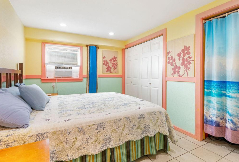 DOWNSTAIRS bedroom with washer/dryer in the closet