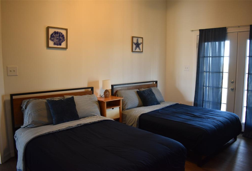 Two roomy primary bedrooms with french doors & bath