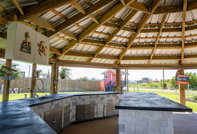 Spacious cabana with ample cabinets and expansive counters, perfect for entertaining.