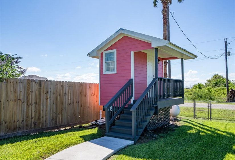 Charming outdoor restroom, perfect for parties and guests, offering convenience and style in your backyard.