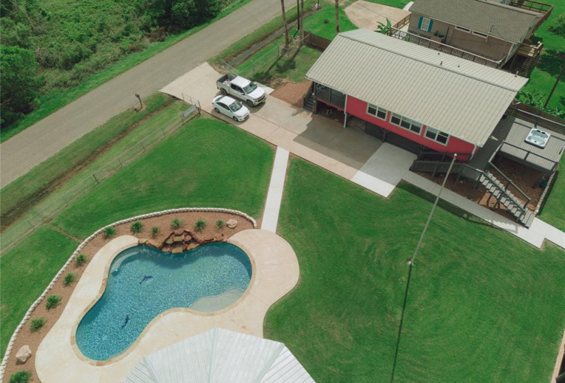 Stunning aerial view showcasing a beautiful pool and home.