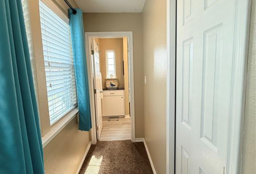 Hallway with closet leads to Master Bedroom Bath.