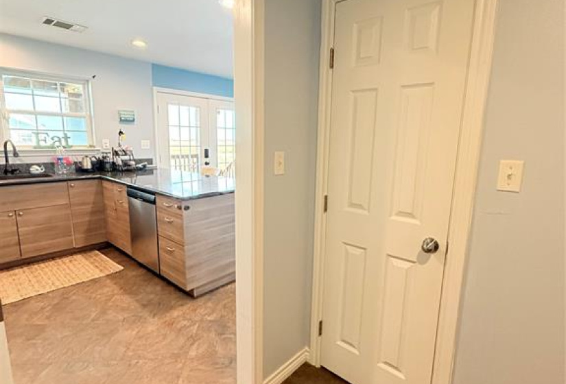 Utility room and access to walk-in pantry.