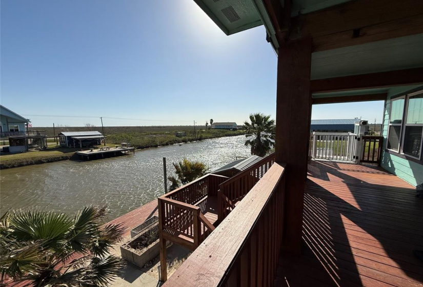 Enjoy your East deck overlooking a serene canal. The view offers a peaceful  environment perfect for relaxation or entertaining.