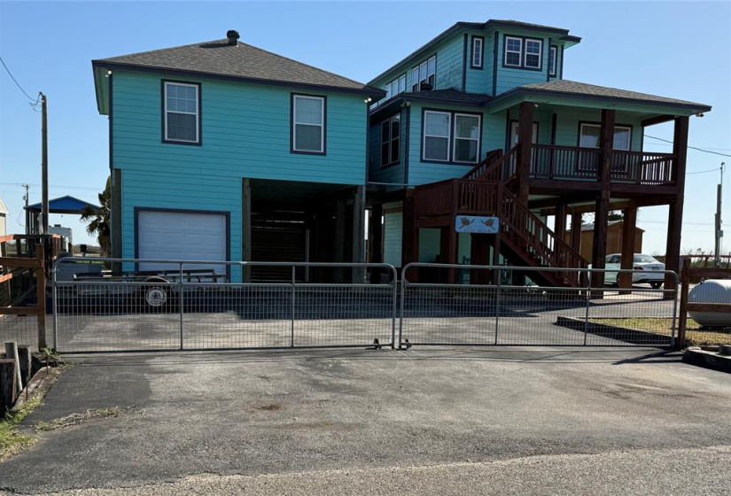 Roadside of house shows ample access to storage and entertainment areas.