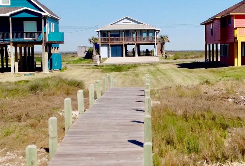 Private boardwalk provides access to and from the beach.