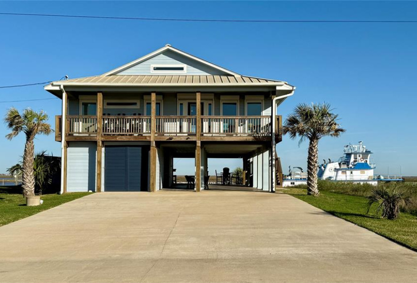 Elevated coastal home with spacious decks front and back to enjoy either your beach  and Gulf view or Intracoastal waterway. Features a large driveway for extra parking and ample shaded space below for entertaining.
