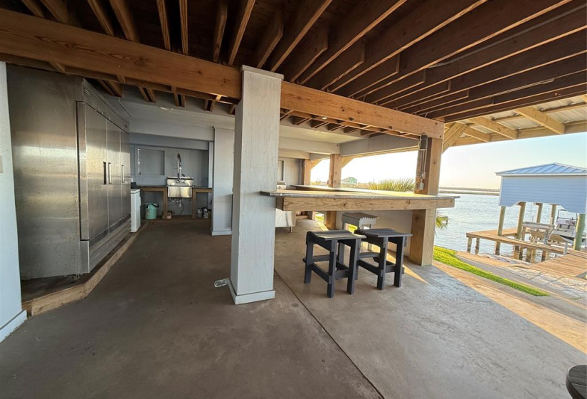 Spectacular outdoor kitchen with commercial 3 door fridge, ice maker and stainless grill. Perfect for entertaining and enjoying the bounty of your catch.