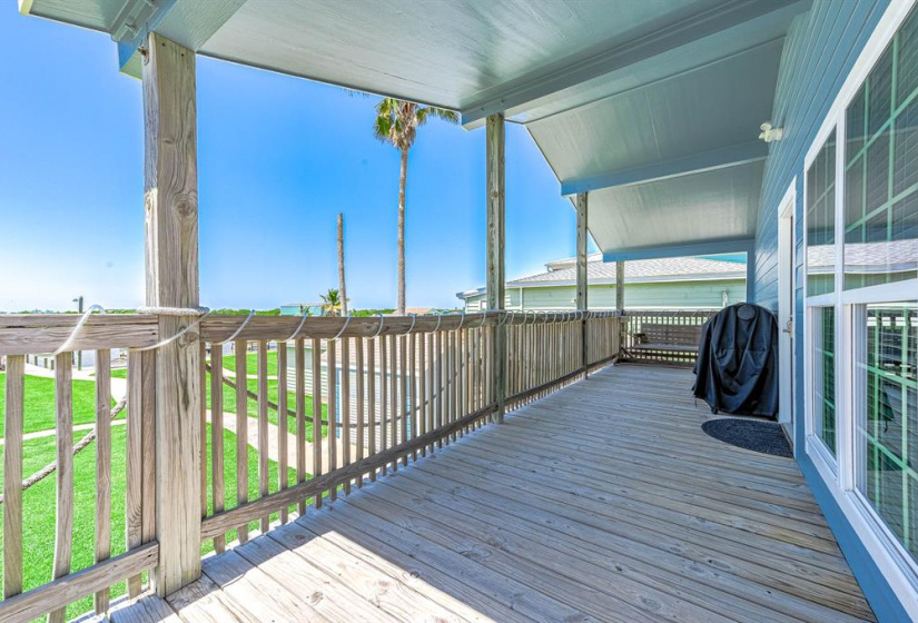 Back porch of home overlooking backyard and Caney Creek.