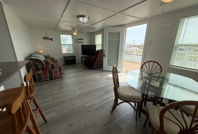 Has three A/C window units; one in the living area and each bedroom has an A/C  unit.