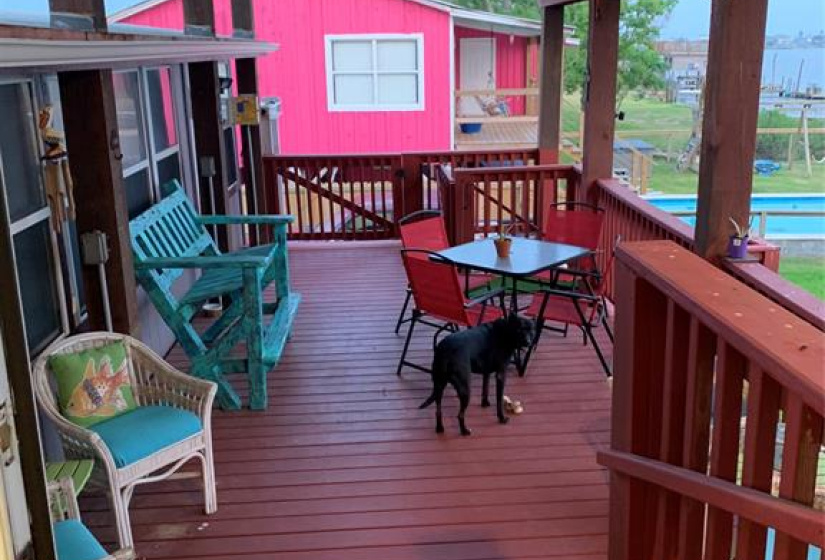 The covered balcony is perfect for a sitting area.