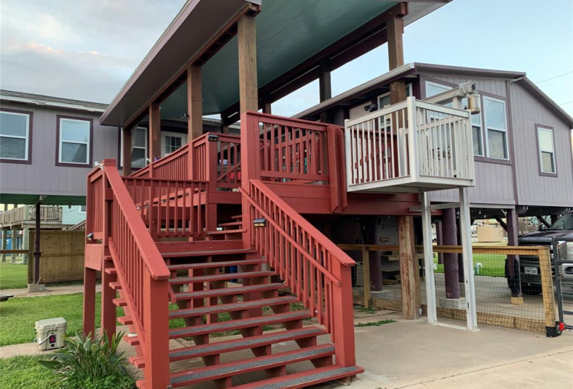 The staircase leads to the covered balcony.