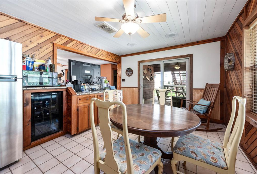 A true gem on Caney Creek, this waterfront home sits on two landscaped lots with mature oaks, water views, and easy access to the ICW, Matagorda Bay, and Sargent Beach. Upstairs features a spacious remodeled kitchen with a huge walk-in pantry, dining area, living room, study, and large primary suite. Covered porch overlooks the creek—perfect for morning coffee or evening sunsets. Downstairs includes two bedrooms, full bath, second living area, game room with bar, utility room, and two-car garage. Multiple p