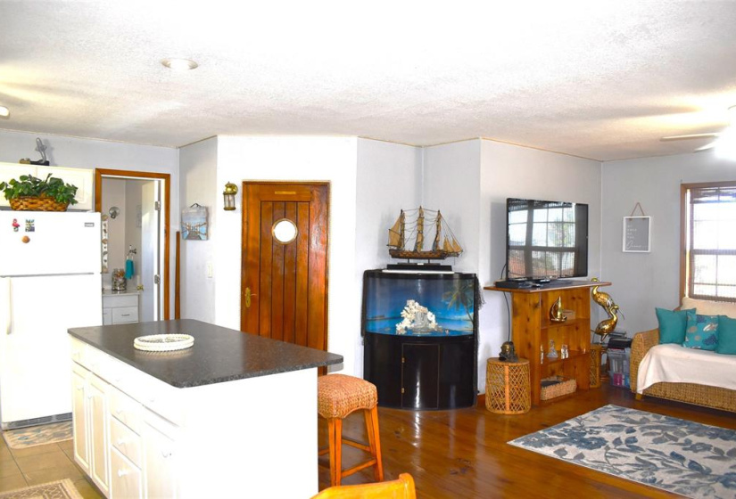 Open concept with real ships door to bedroom