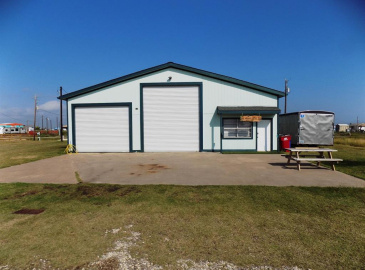 One of a kind shop, boats and RV storage, entertainment/living area, loft area above.  This property is being sold with all 3 lots!