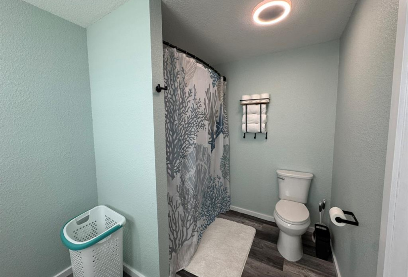 Updated primary bathroom with dual vanities.