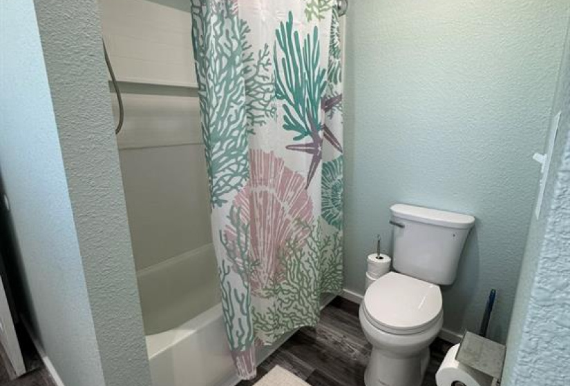 Secondary bathroom with dual vanities.