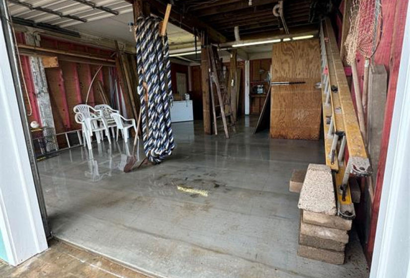 Covered area, can be used for parking or entertaining.