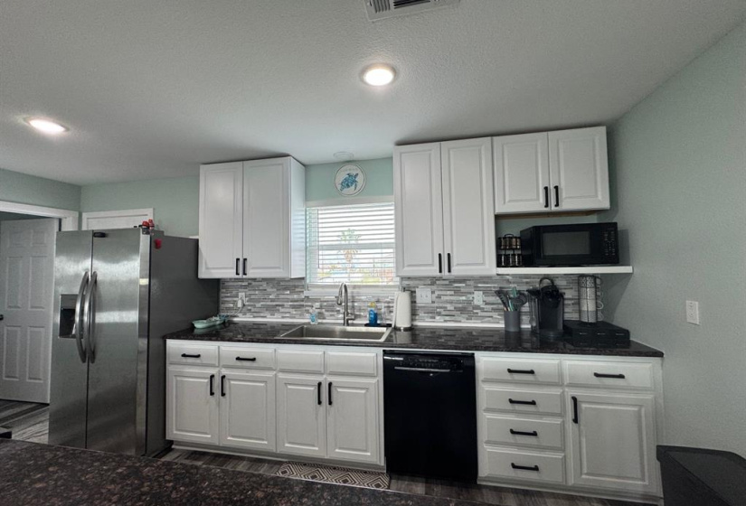 Kitchen with extra large island allowing for extra seating.