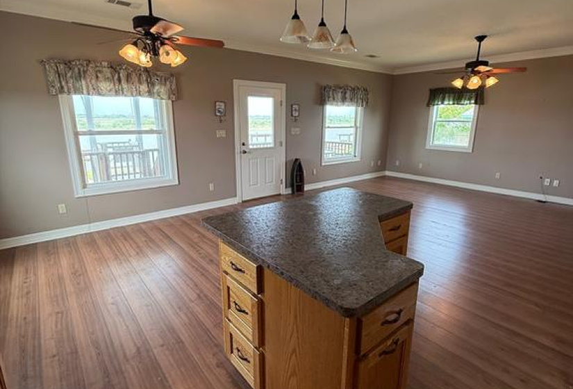 KITCHEN FEATURES A LARGE CENTER ISLAND WITH AMPLE STORAGE.
