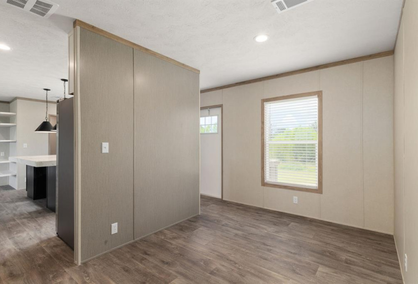 The breakfast room is conveniently located next to the kitchen