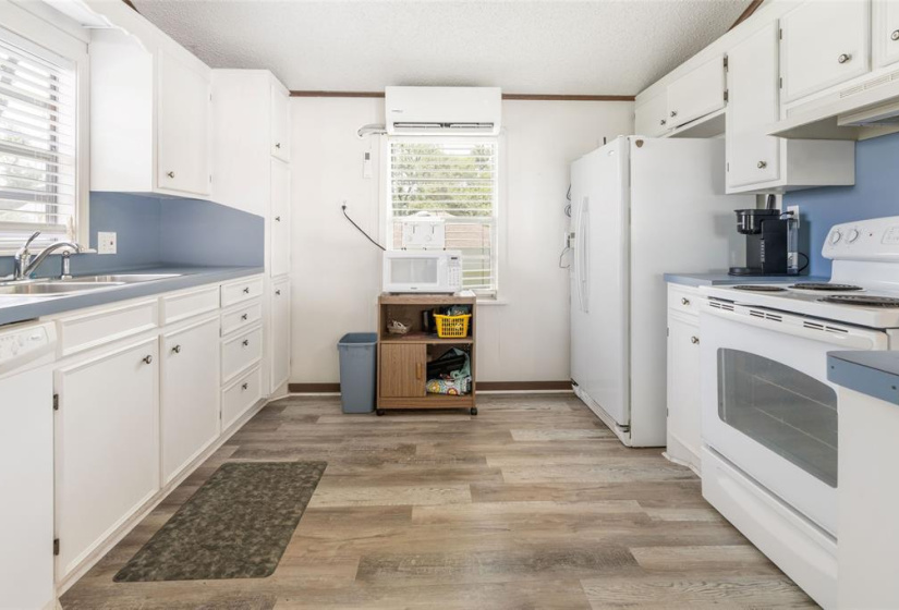 Kitchen is located to the left as you walk inside from sliding door.