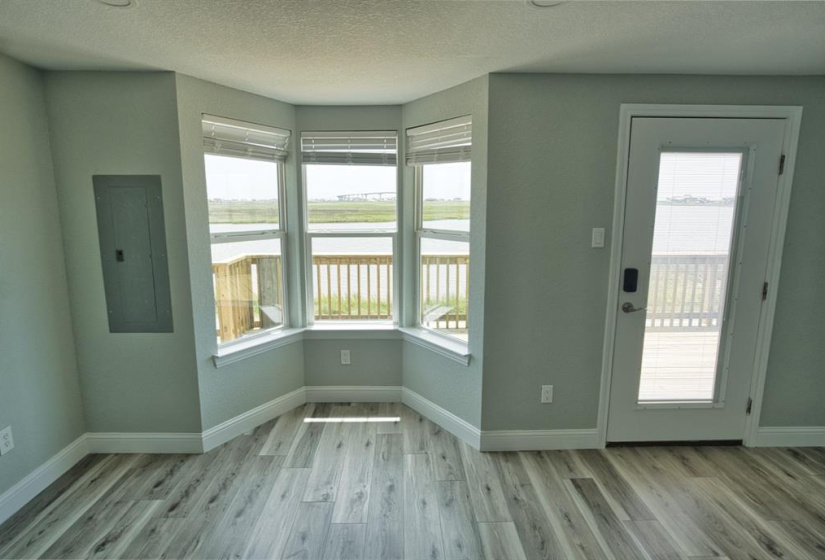 Large master suite with bay windows looking out at Old Caney Lake!