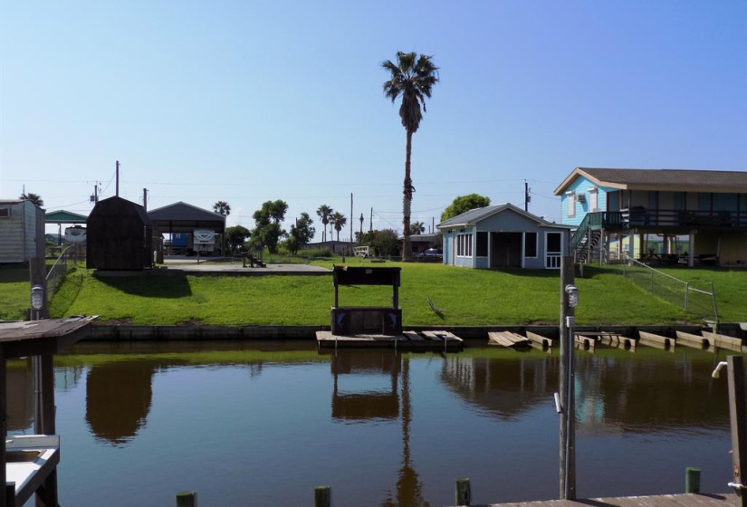 2 nice and high canal front lots, with fenced yard and concrete pad.
