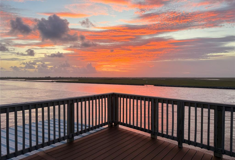Savor breathtaking sunsets from your elevated boathouse deck.