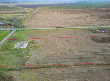 UNRESTRICTED ~4 acres of cleared land in the HEART OF SARGENT - just off FM 457 as you come into town - iIMAGINE the POSSIBILITIES with this property!   boundary lines are approximate and will need to be verified by the buyer