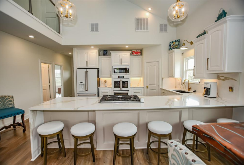 Large breakfast bar - beautiful counter top - one piece across the counter to the floor on the left - such a nice place to visit with friends and family!