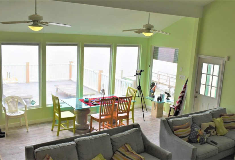 You have such a view outside from the dining area!  Play cards and watch the boats go by!  All those picture windows have electronic storm shutters as well.