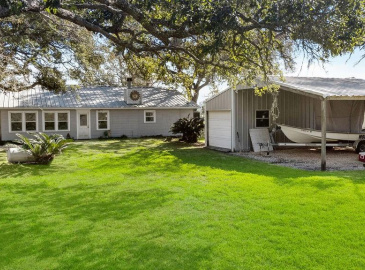What a perfect piece of Paradise! Sitting on 100 feet of Caney Creek this 2/1/1 has 2 fireplaces and a small shop with lean-to.  Newer bulkhead and oversized pier!