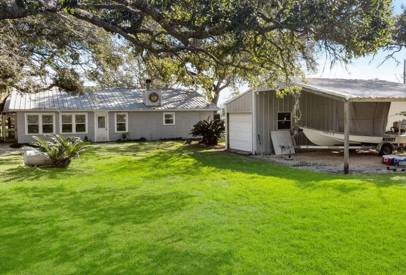 What a perfect piece of Paradise! Sitting on 100 feet of Caney Creek this 2/1/1 has 2 fireplaces and a small shop with lean-to.  Newer bulkhead and oversized pier!