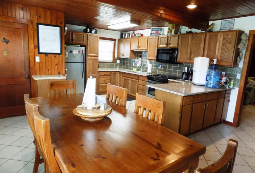 Plenty of room in this dining/kitchen to bring friends and family together.