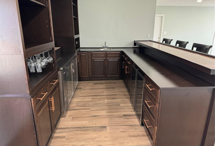 In addition to the large stainless beverage cooler, there is also a sink and two stainless wine fridges so you can keep your reds and whites at different temperatures for optimal storage. The beverage cooler and wine fridges are all brand new, just installed and never used!