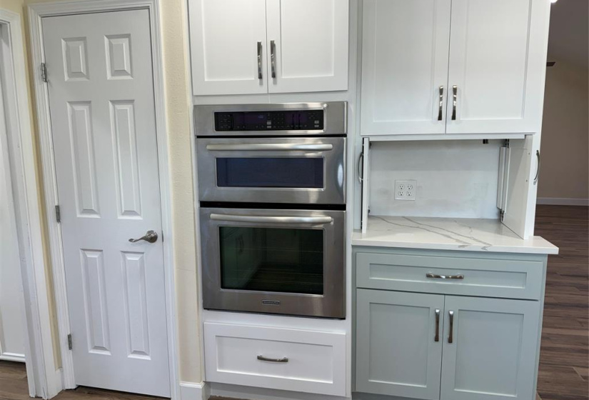 Double convection wall oven and microwave combo. Notice the appliance garage to the right that is open in this pic, where you can put your coffee maker, blender, air fryer, etc