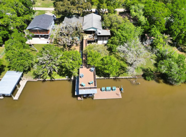 Areal View Of Property With Pier and Boathouse