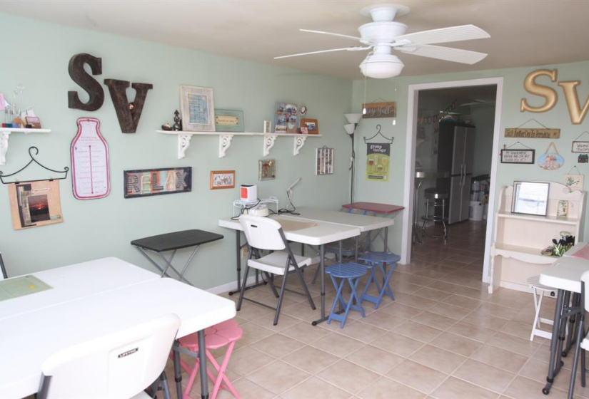 Downstairs has two rooms with an open doorway and a full bathroom. Currently being used as a designated Craft Room!!